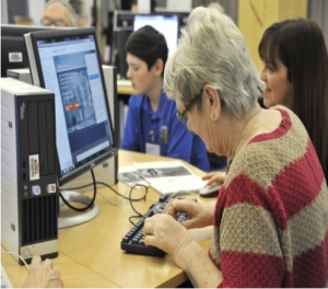 an old lady using a computer at the event