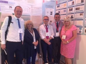 Chris Barr, Hilary Hallas, Steve Benson, Graeme Bentley, Viv Wallace at the CI Stand.