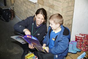 Adult reading to child