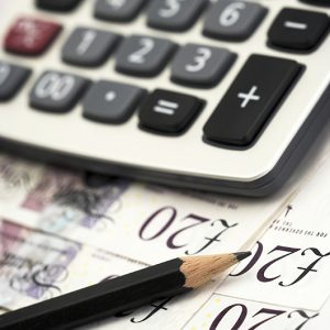 bills,pen and calculator close up