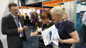 Two volunteers signing up to a session at CS Live 