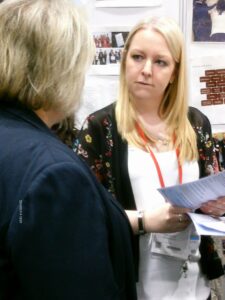 A volunteer talking to a visitor