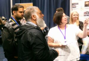 Interested attendees at a stand at CS Live