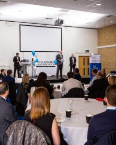 Speakers on stage at awards event