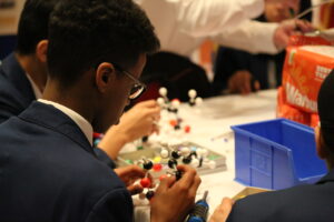 Schoolboy concentrating at activity table