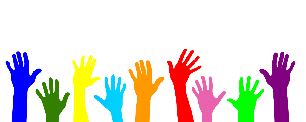 Multi coloured hands raised
