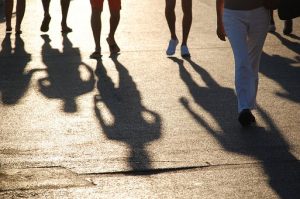 picture of various legs of people with shadows on the floor to depict job shadowing