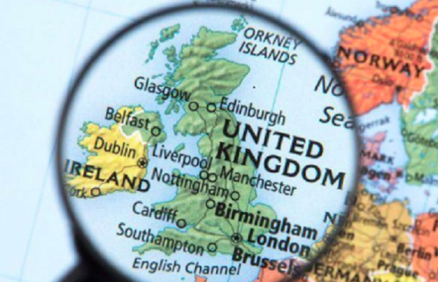 A magnifying glass over a map of the UK