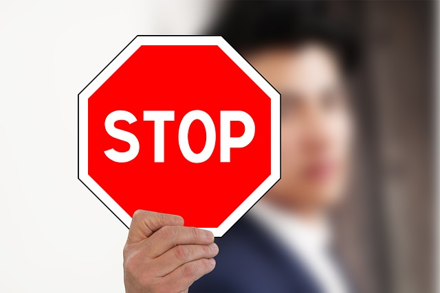 Person holding a stop sign