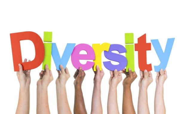 Diversity letter in different colour carried by many hands