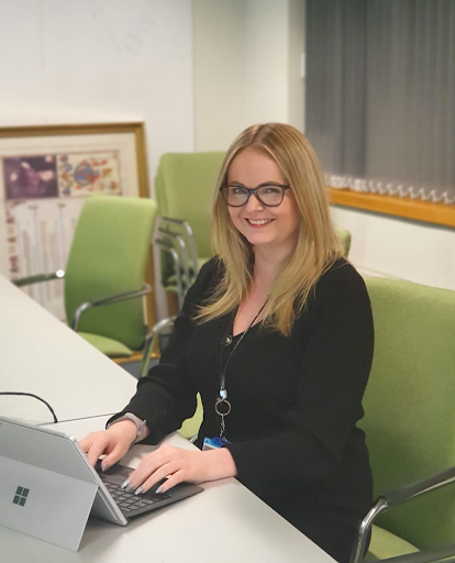 Lauren Hope, HMRC sitting in front of computer