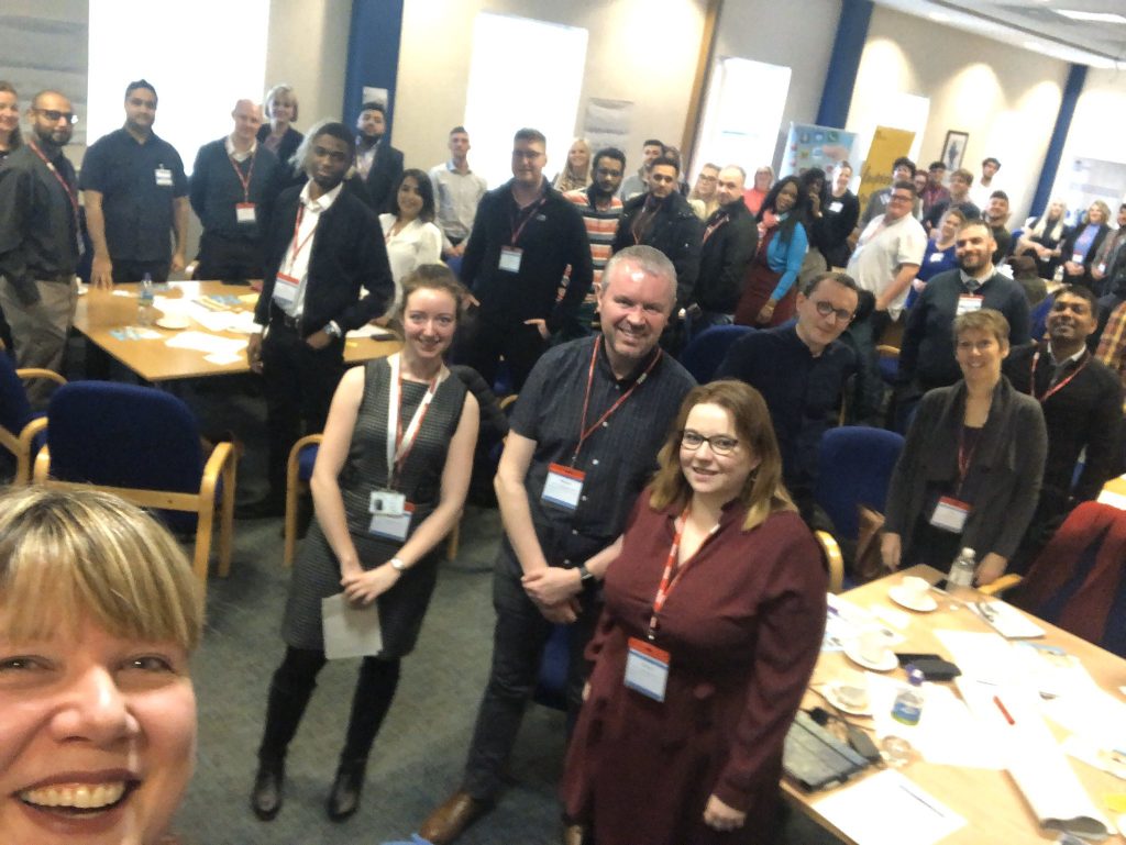 Attendees at the apprentice network meeting standing