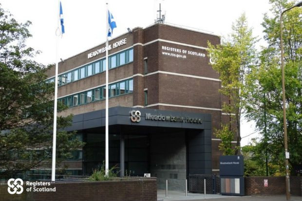 registers of Scotland red brick building 4 floors with Scotland flag on flagpole