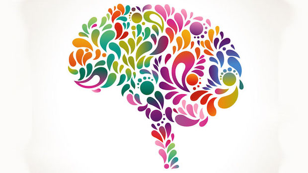 Brain silhouette coloured in with different coloured swirls